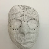 decorating a plaster cloth mask